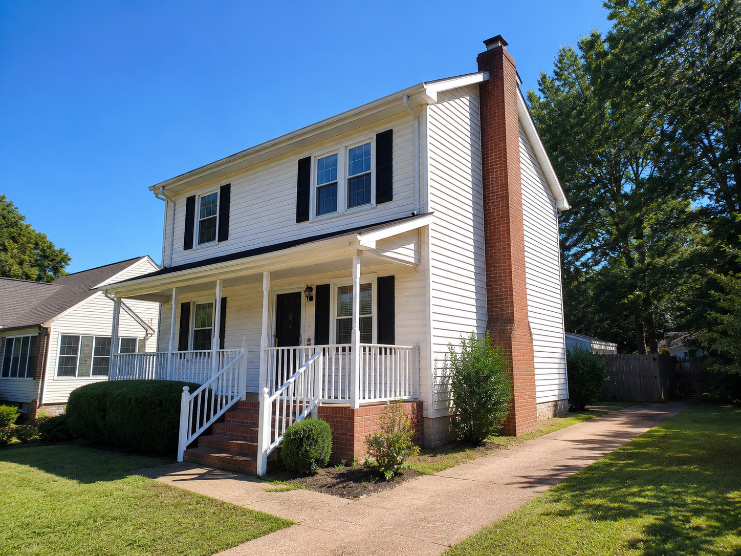 Side exterior of a two-story single-family investment property